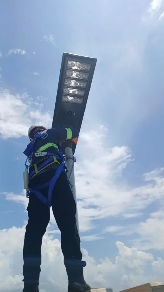 technician-installing-all-in-one-solar-street-light-pole